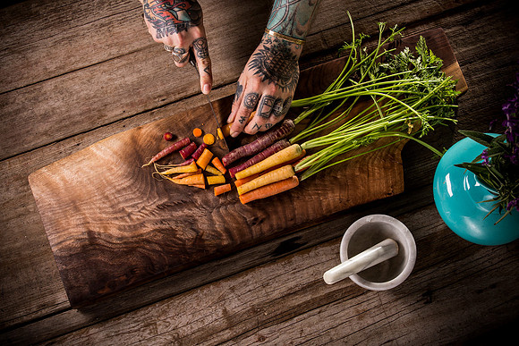 food-red-orange-yellow-carrots-hands-cutting