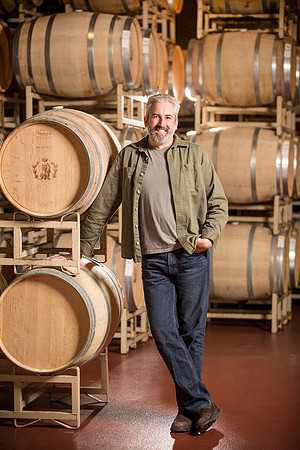 people-man-with-barrels-winery