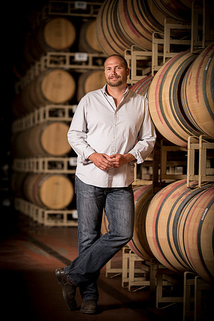 people-portrait-wine-maker-barrels