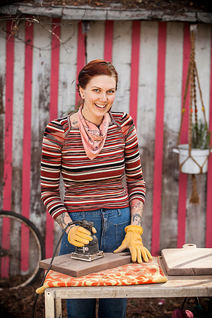 people-sanding-woman-red-stripes-smiling