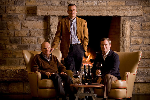 people-three-men-fireplace-portrait-wine