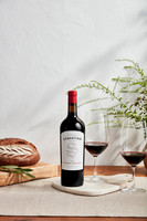 Sebastiani Cabernet Sauvignon on table with greenery and bread